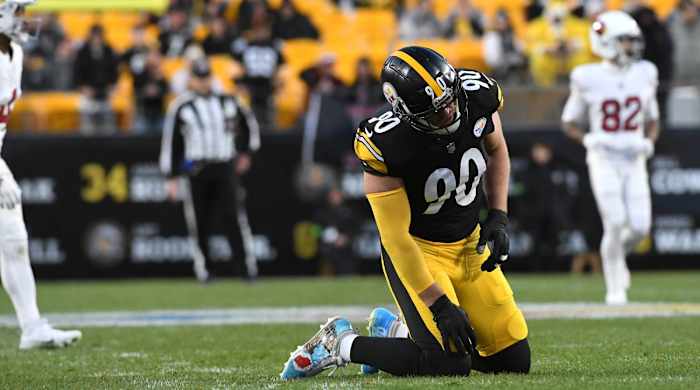 T.J. Watt is slow to get up after a play against the Cardinals.